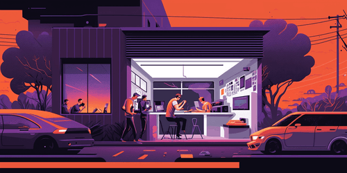 Startup in the garage, with some young people working on their computers